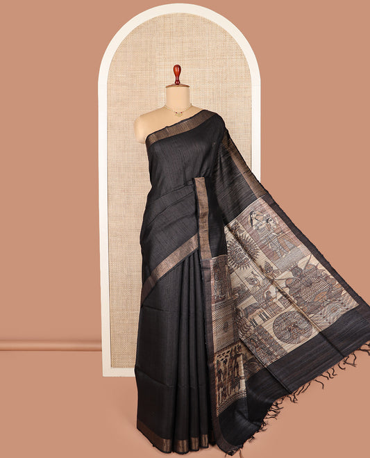 Grey tussar silk saree, bavanji border, and pallu features Madhubani human motifs print