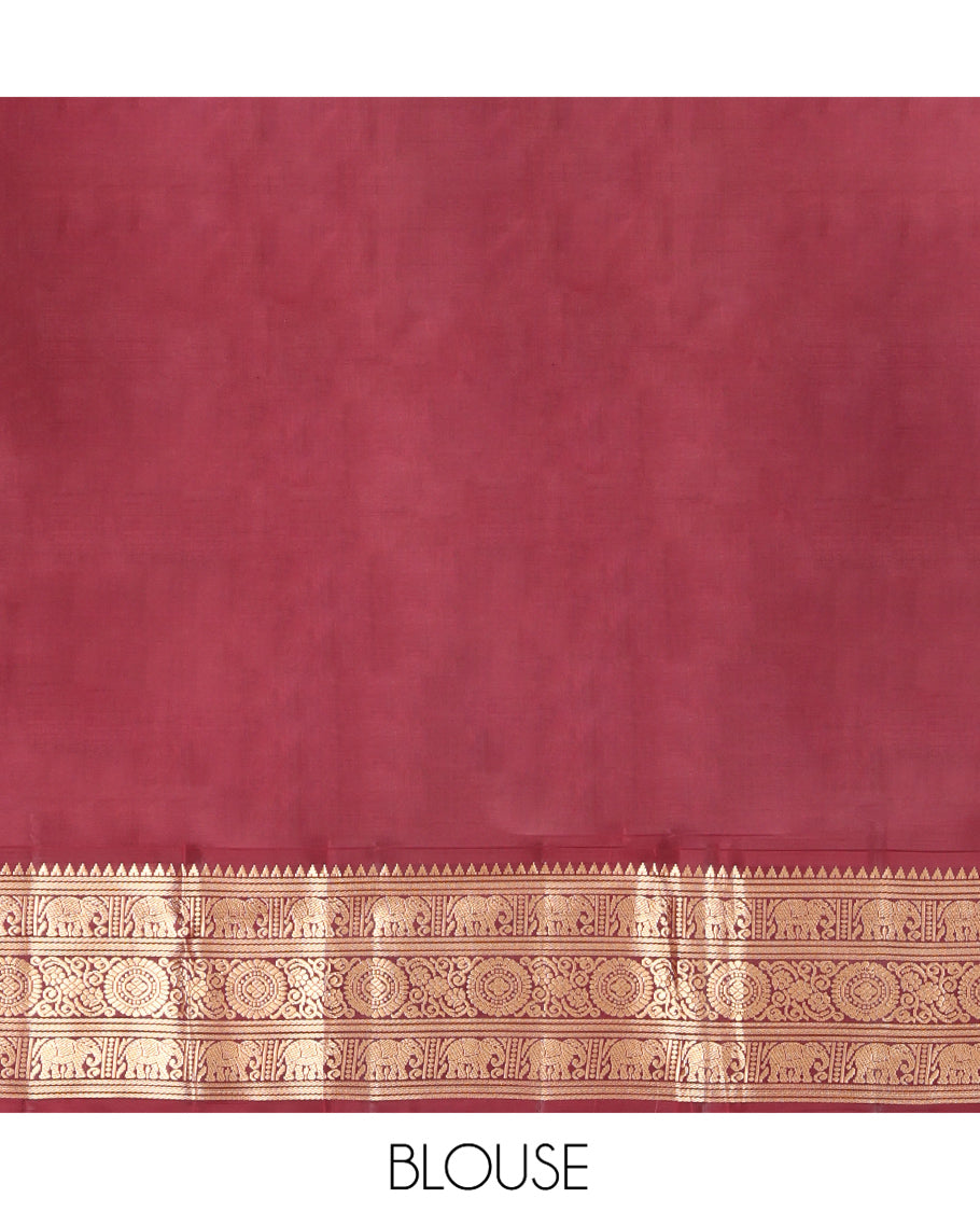 Rust Orange Vasundhara Silk Saree, Embellished with Mayil and Yaanai Buttas Across Its Body, Complemented by a Contrast Korvai Border of Rekku, Banaras, Yaanai, and Chakram Designs, Gleaming Jaal Pallu, and Paired with a Contrast Blouse