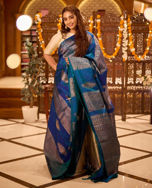 Borderless peacock blue thazampoo rekku,  and geometric patterns zari woven Kanchipuram silk saree, zari pallu of manga and paiyaadi kattam designs