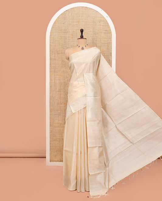 Cream Plain Tussar Silk Saree, a Gleaming Temple Zari Border, a Striped Pallu, and a Matching Blouse