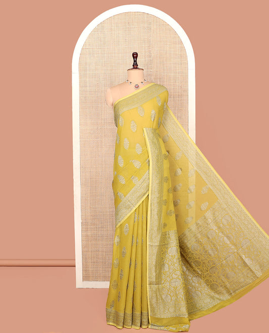 Yellow Georgette Saree, Elevated with Buttas, Highlighted by a Traditional Border, Floral Jaal Pallu, and a Matching Blouse