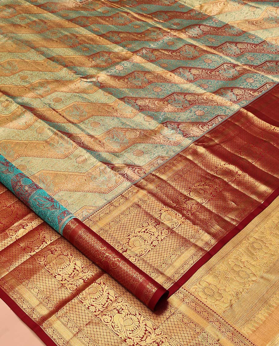 Blue Kanchipuram Tissue Silk Saree, Beautifully Bedecked with Meenakari Jacquard, a Contrast Border of Kodi Visiry, Jaal, and Mayil Designs, Diagonal Striped Pallu, and Contrast Blouse