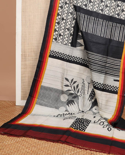 Black and white geometric printed silk saree with contrast border & floral design pallu