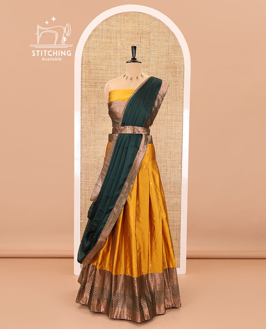 Mustard-green taffeta half-saree, zari buttas with contrast traditional zari bordered skirt, a matching blouse, and contrast zari border dhavani with belt