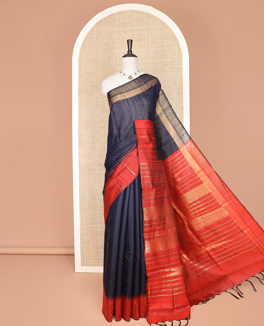 Navy Blue Plain Dupion Silk Saree, Complemented by a Contrast Temple Border, Gleaming Traditional Motifs Woven Pallu, and Paired with a Contrast Blouse
