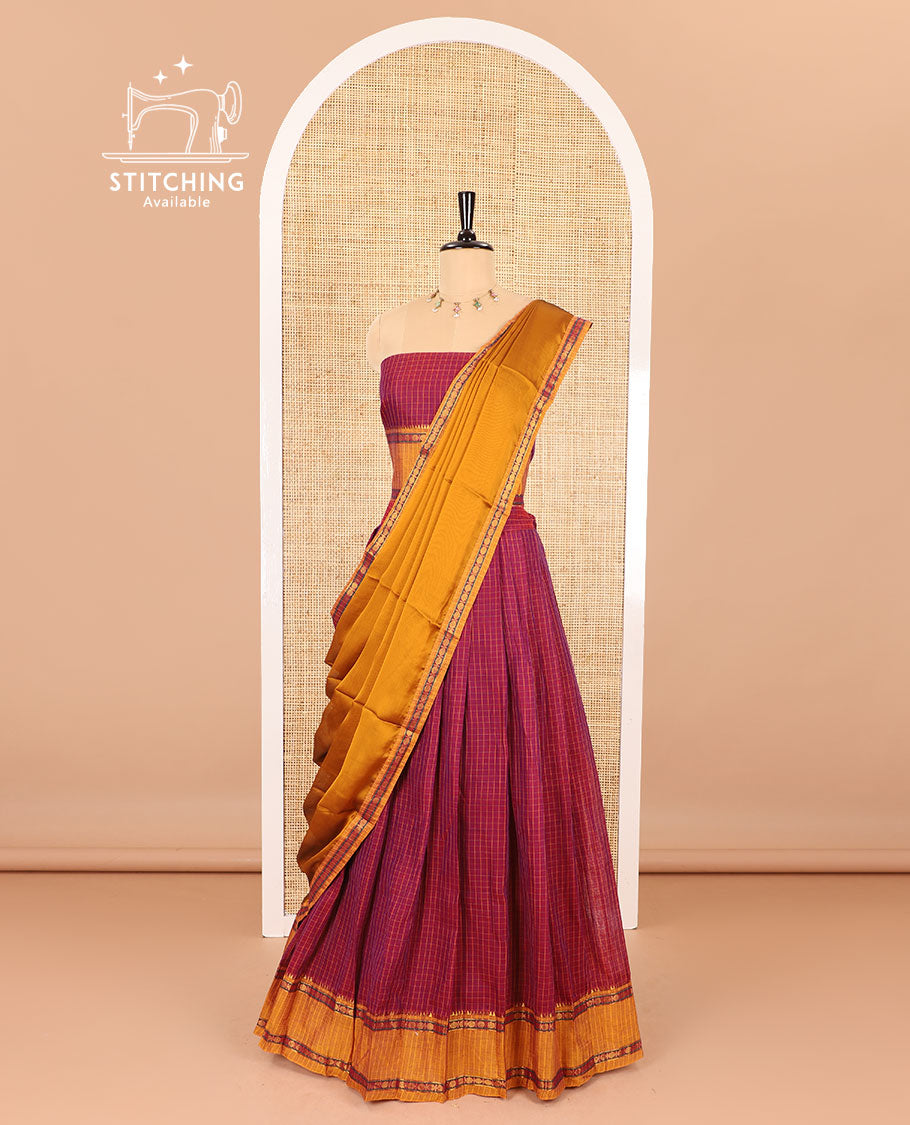 Maroon half-saree, checked with contrast traditional motifs zari bordered skirt, matching blouse and a contrast zari border plain dhavani