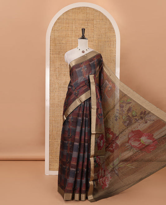 Multi-color geometric-abstract printed black spun linen saree, gold zari piping border, floral motifs printed pallu & striped blouse