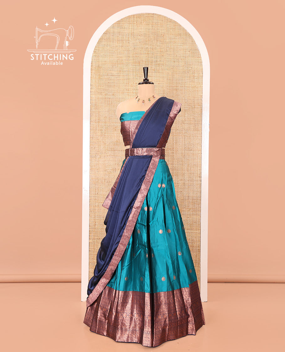 Blue and Navy Blue Semi-Banarasi Half-Saree, Adorned with Zari Buttas on Its Skirt, Complemented by a Contrast Traditional Zari-Design Border, Paired with a Matching Blouse, and a Contrast Satin Georgette Zari-Bordered Dhavani