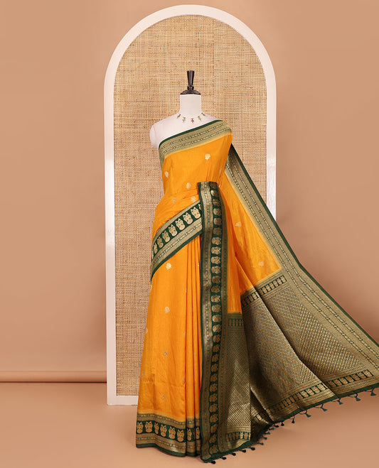 Mustard peacock buttas dola silk saree, contrast rudraksham & iruthalai pakshi border, intricate pallu & contrast jacquard blouse