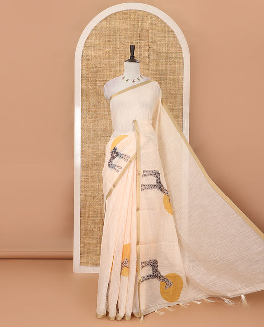 Cream plain & giraffe motifs printed linen cotton saree, zari piping border, giraffe printed pallu & vertical striped blouse