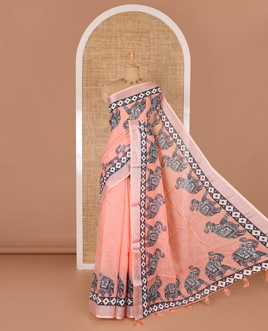 Orange plain linen cotton saree, silver zari border of elephant motifs print, elephant motifs pallu, and a contrast elephant motifs printed blouse