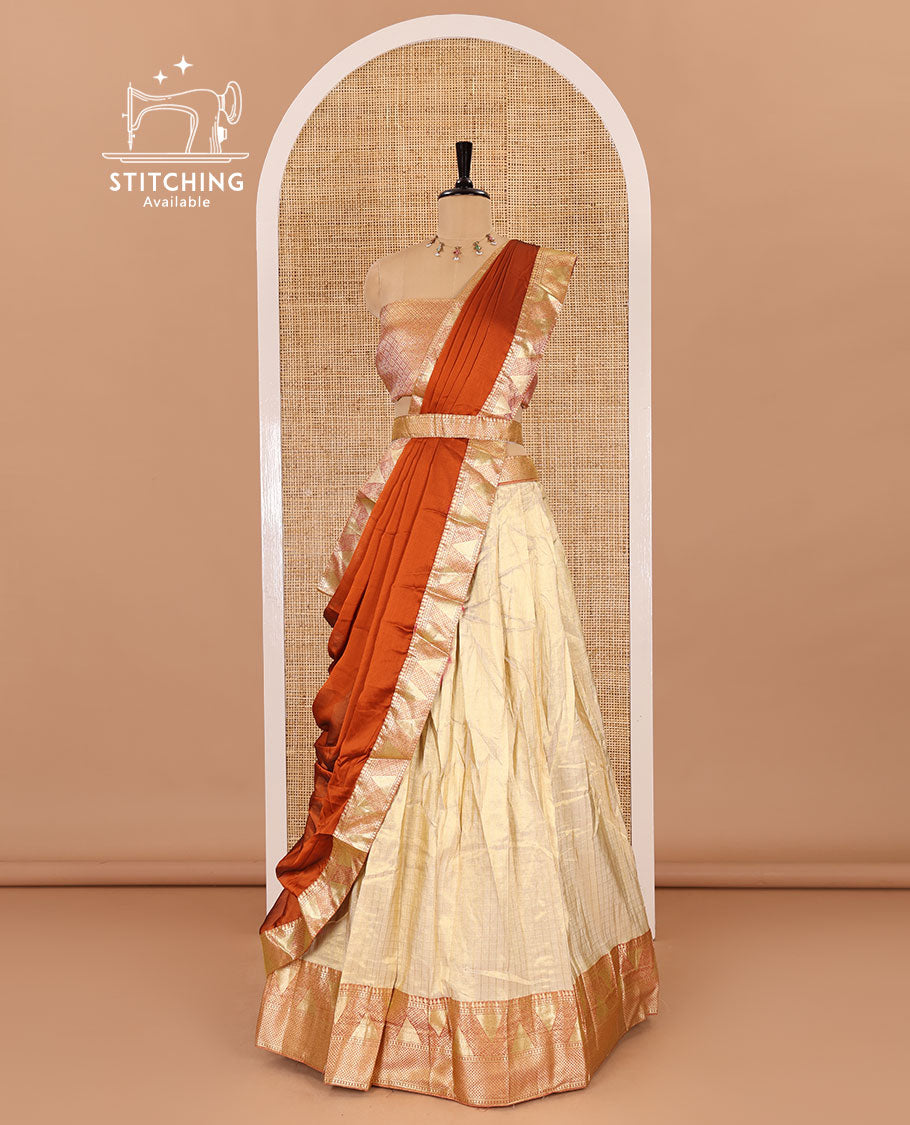 Chikku and rust half-saree, zari checked with contrast traditional zari bordered banarasi skirt, jacquard blouse, and a contrast zari bordered syska georgette dhavani