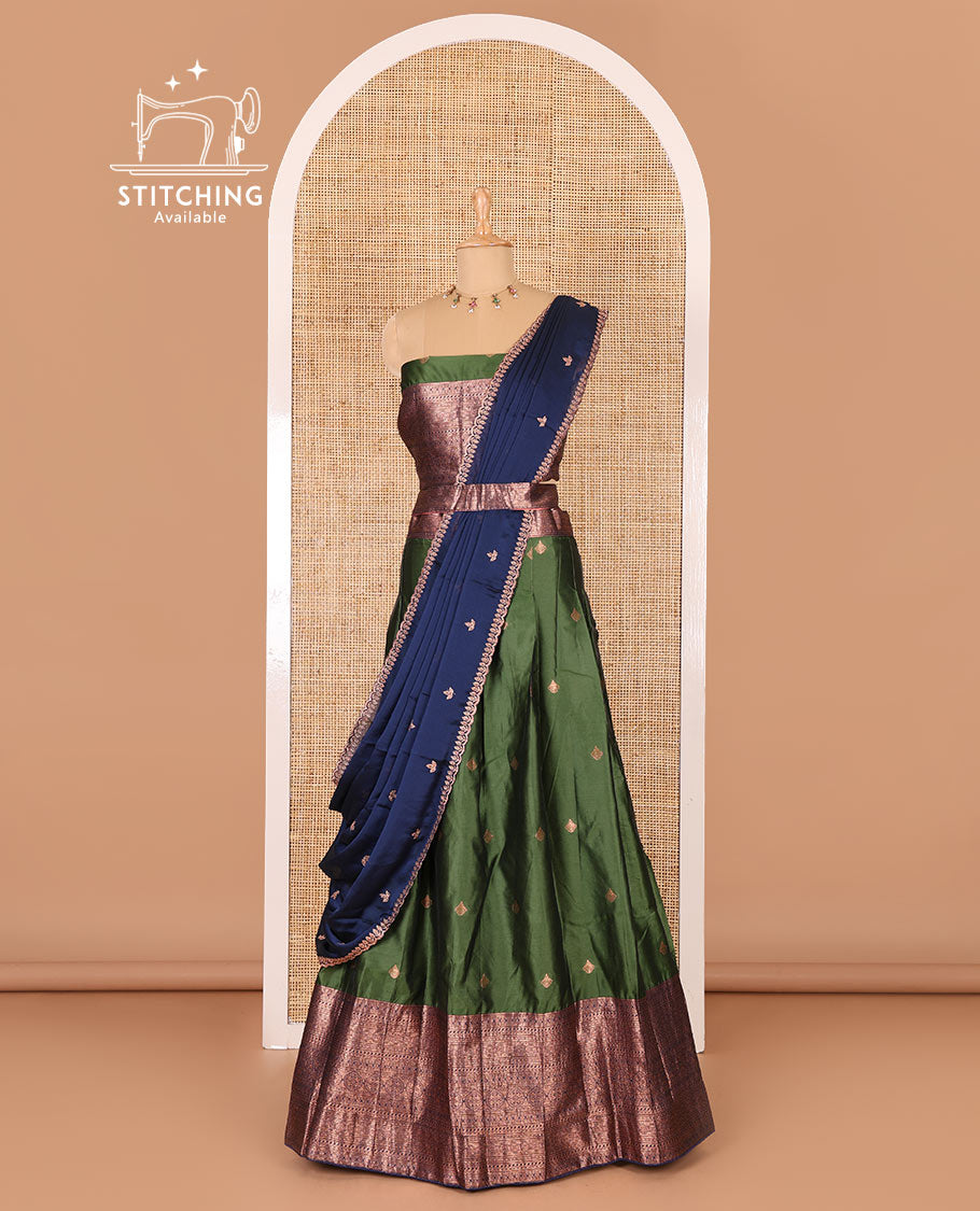 Bottle green taffeta silk half-saree, zari buttas and contrast traditional zari bordered skirt, a matching blouse, and contrast embroidered satin georgette  dhavani