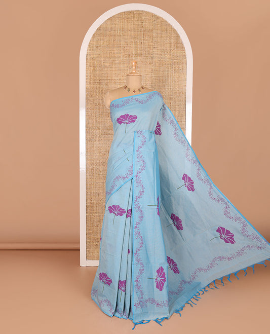 Blue lotus leaf motifs printed South cotton saree with floral creeper border, a matching blouse, and a contrast buttas block printed blouse