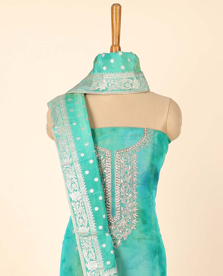 Blue material chudidhar set, abstract print & embroidered top, plain bottom & Banaras buttas duppata