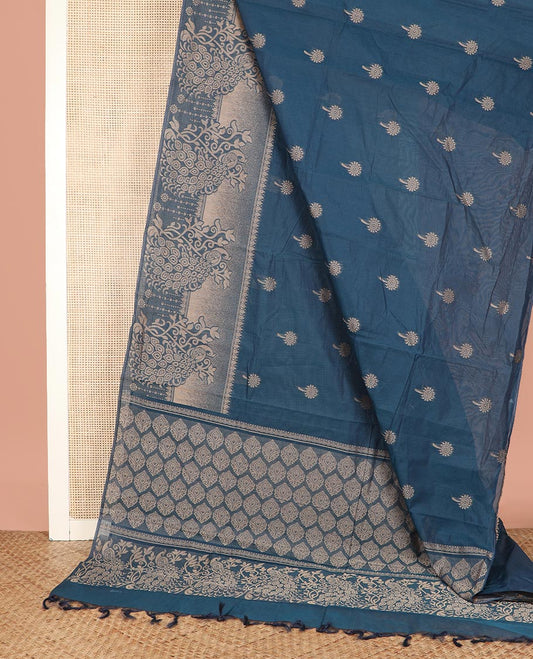 Blue Coimbatore Cotton Saree Features Floral Buttas All Over Its Body, a Subtle Self-Border of Peacock Designs, Pallu Depicts Geometric Patterns, and Is Paired with a Matching Blouse