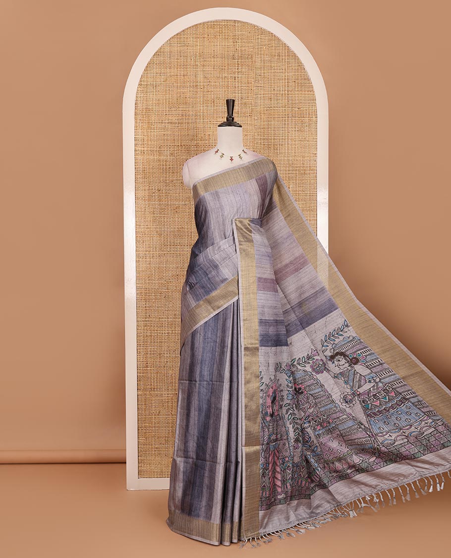 Grey vertical stripes printed hand-brush dyed Katan silk saree, gold zari bavanji border, Madhubani-style human figurines printed pallu, and floral printed blouse