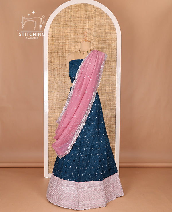 Blue half-saree, floral motifs embroidered semi raw silk top, matching embroidered blouse, and contrast scallop embroidered georgette dhavani