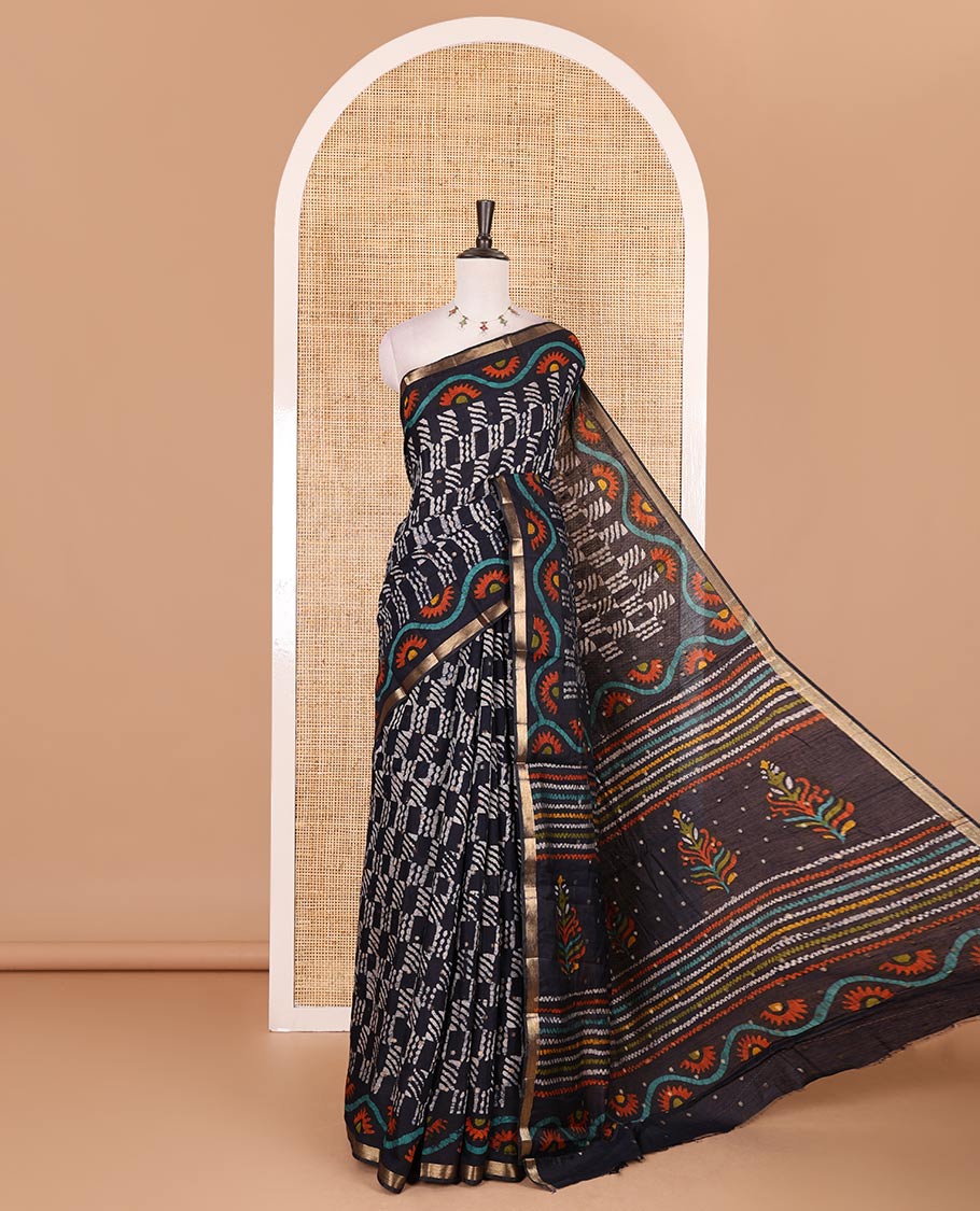 Navy blue batik printed with zari buttas woven chanderi cotton saree, zari piping border, batik printed pallu, and batik printed matching blouse