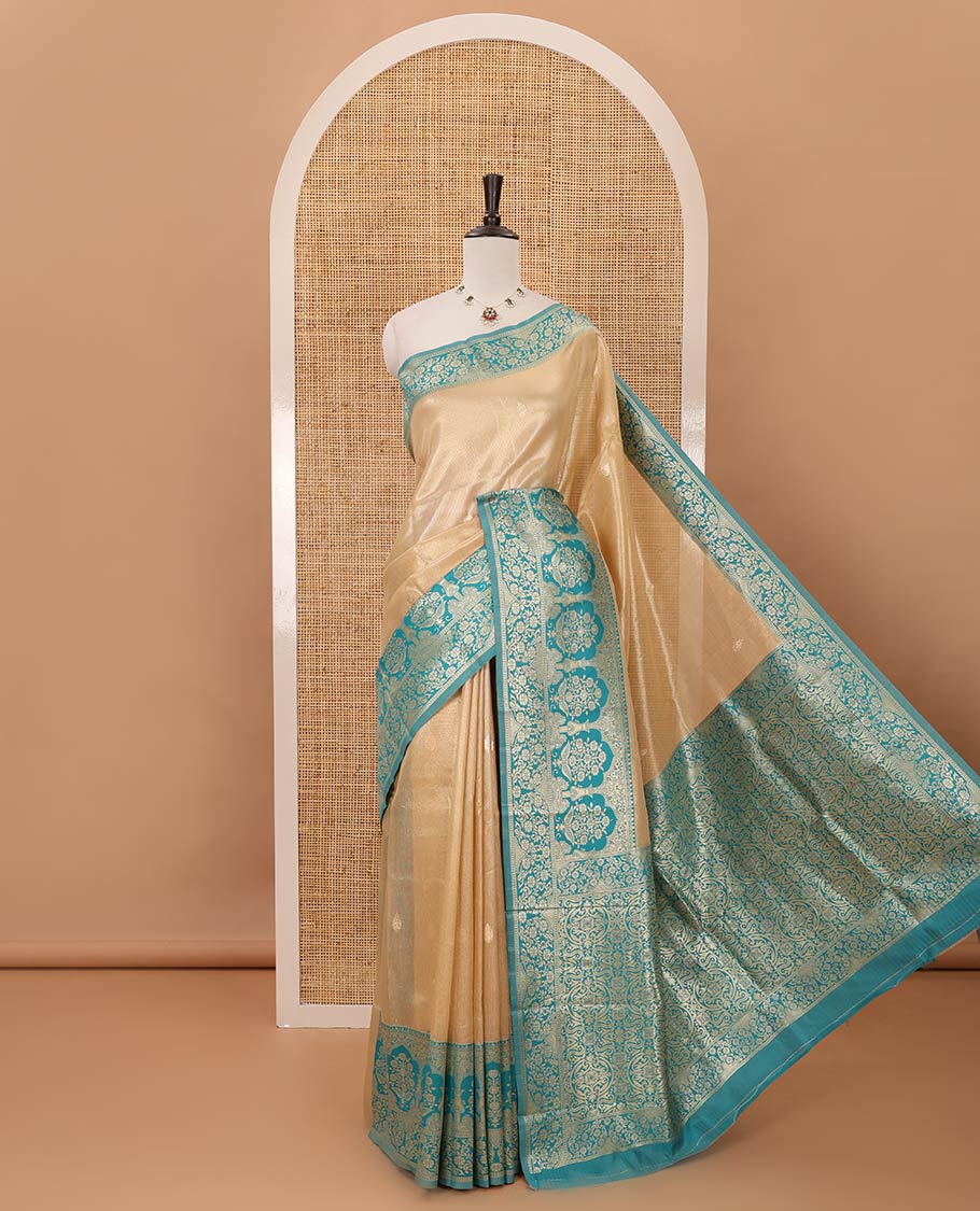Cream color Antique buttas twill tissue saree, contrast satin thread woven border & pallu of mughal-style motifs & buttas green blouse