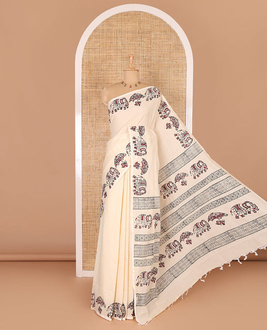Cream plain South cotton saree, umbrella, and elephant motifs block printed border, block printed pallu, a matching blouse and a contrast floral vine block printed blouse