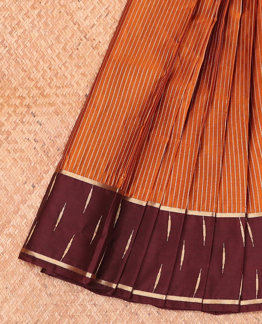 Rust Orange Budget Silk Saree Ornamented with Dotted Stripes, Complemented by a Contrast Traditional Temple Zari Border, Decked Up with Intricate Pallu, and Paired with a Contrast Blouse
