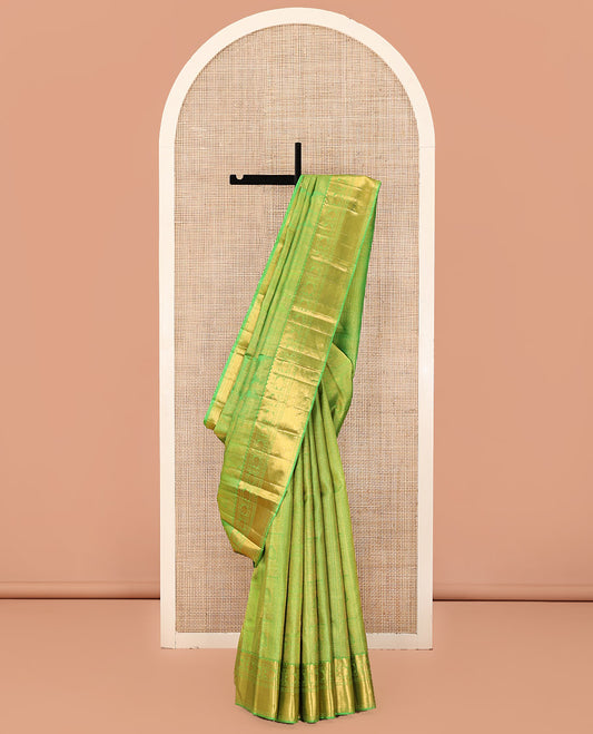 Green Kanchipuram Wedding Silk Saree, Entralled with Jacquard Design On Its Body, Highlighted by Zari Border of Rekku, Kathir, Muthu, Manga and Zari Stripes, Grand Pallu and Paired with a Matching Blouse