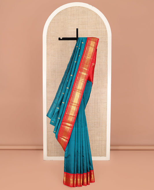 Blue Kanchipuram Silk Saree, Beautified with Zari Buttas on Its Body, Complemented by Contrast One-Sided Korvai Border of Panner Sombu, Banaras, Muthu, and Mayil Kann Designs, Pallu Features Zari Designs, and Comes Without a Blouse