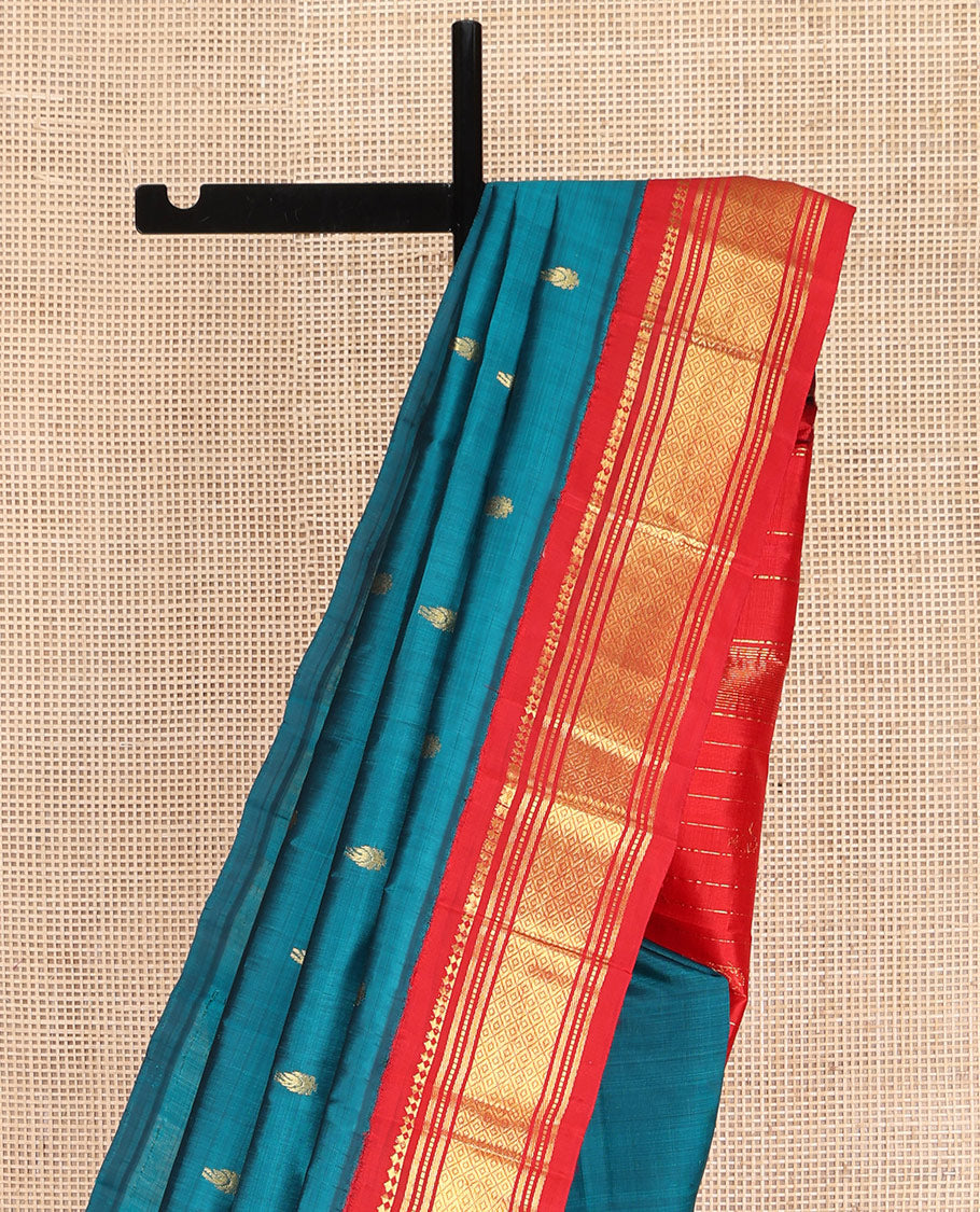 Blue Kanchipuram Silk Saree, Beautified with Zari Buttas on Its Body, Complemented by Contrast One-Sided Korvai Border of Panner Sombu, Banaras, Muthu, and Mayil Kann Designs, Pallu Features Zari Designs, and Comes Without a Blouse