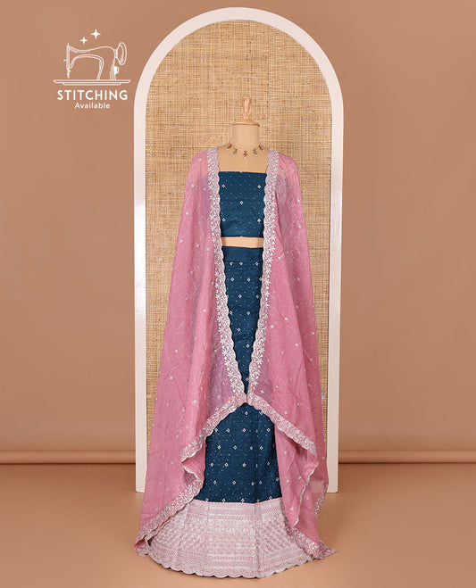 Blue half-saree, floral motifs embroidered semi-raw silk top, matching embroidered blouse, and contrast scallop embroidered georgette dhavani