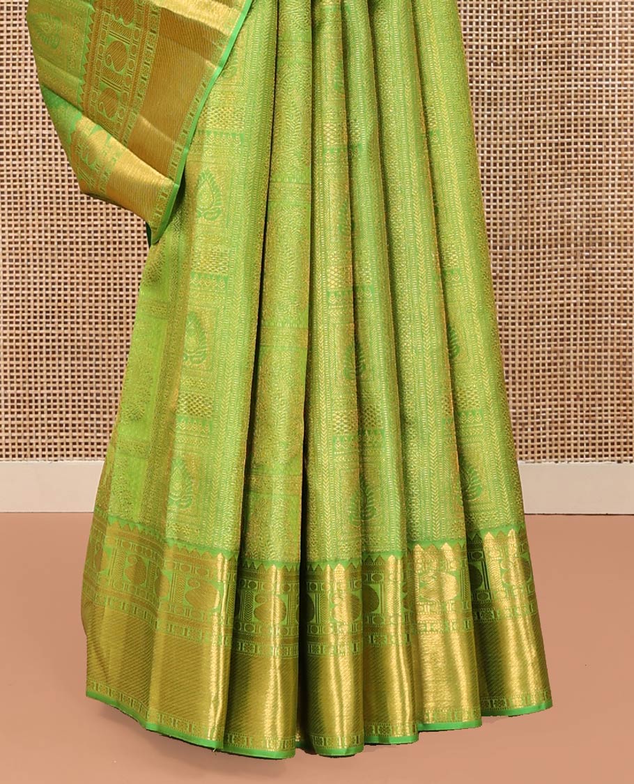 Green Kanchipuram Wedding Silk Saree, Entralled with Jacquard Design On Its Body, Highlighted by Zari Border of Rekku, Kathir, Muthu, Manga and Zari Stripes, Grand Pallu and Paired with a Matching Blouse
