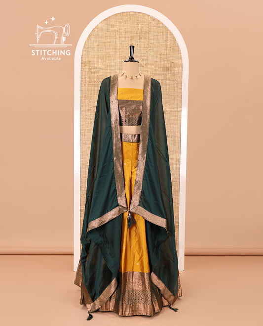 Mustard-green taffeta half-saree, zari buttas with contrast traditional zari bordered skirt, a matching blouse, and contrast zari border dhavani with belt