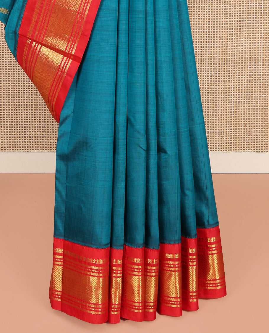 Blue Kanchipuram Silk Saree, Beautified with Zari Buttas on Its Body, Complemented by Contrast One-Sided Korvai Border of Panner Sombu, Banaras, Muthu, and Mayil Kann Designs, Pallu Features Zari Designs, and Comes Without a Blouse