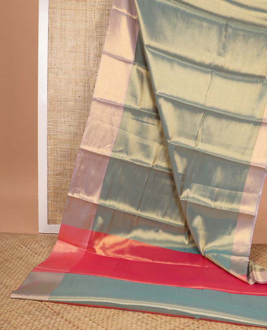 Dark green chevron design semi tissue saree with contrast zari design border & striped pallu