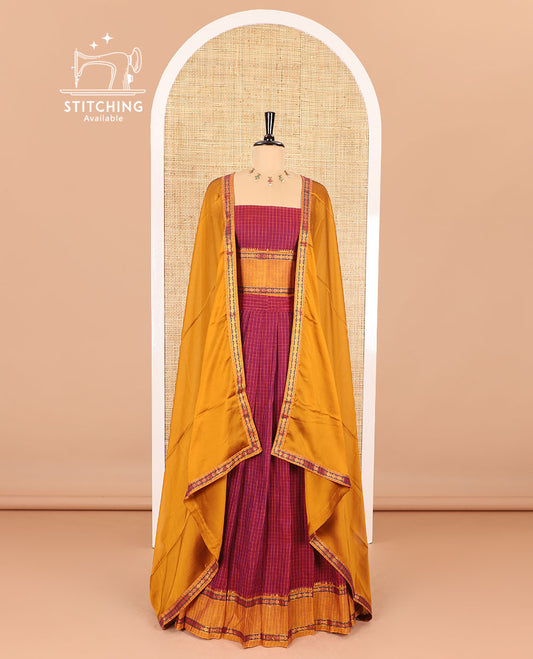 Maroon half-saree, checked with contrast traditional motifs zari bordered skirt, matching blouse and a contrast zari border plain dhavani