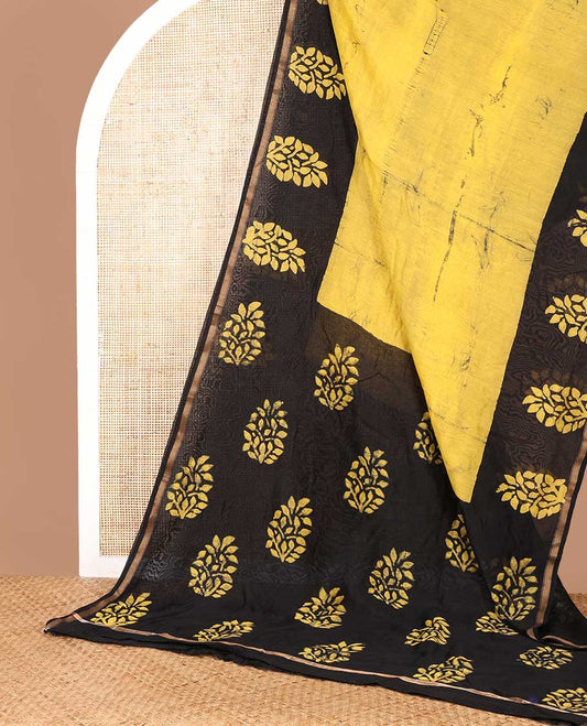 Yellow hanblock batik printed chanderi cotton saree with contrast wax block printed border & hand block printed pallu along with plain blouse