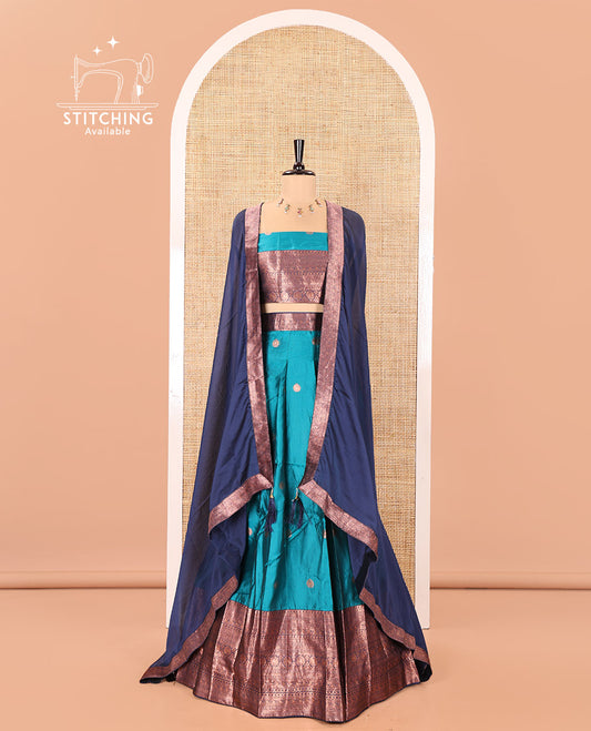 Blue and Navy Blue Semi-Banarasi Half-Saree, Adorned with Zari Buttas on Its Skirt, Complemented by a Contrast Traditional Zari-Design Border, Paired with a Matching Blouse, and a Contrast Satin Georgette Zari-Bordered Dhavani