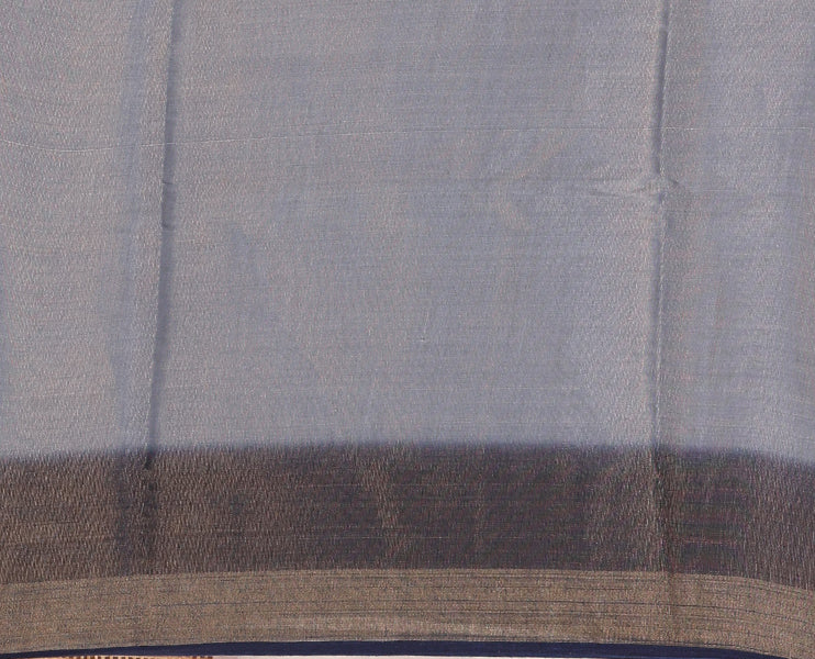 Grey plain tissue saree, contrast gold zari piping border & self pallu with tussels