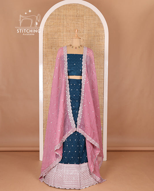 Blue half-saree, floral motifs embroidered semi raw silk top, matching embroidered blouse, and contrast scallop embroidered georgette dhavani