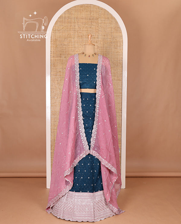 Blue half-saree, floral motifs embroidered semi raw silk top, matching embroidered blouse, and contrast scallop embroidered georgette dhavani