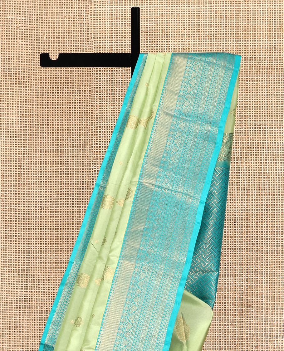 Green Vasundhara Lite Silk Mix Saree, Gleamed Up with Zari Buttas, a Contrast Traditional Zari Border, an Intricate Pallu, and a Contrast Blouse
