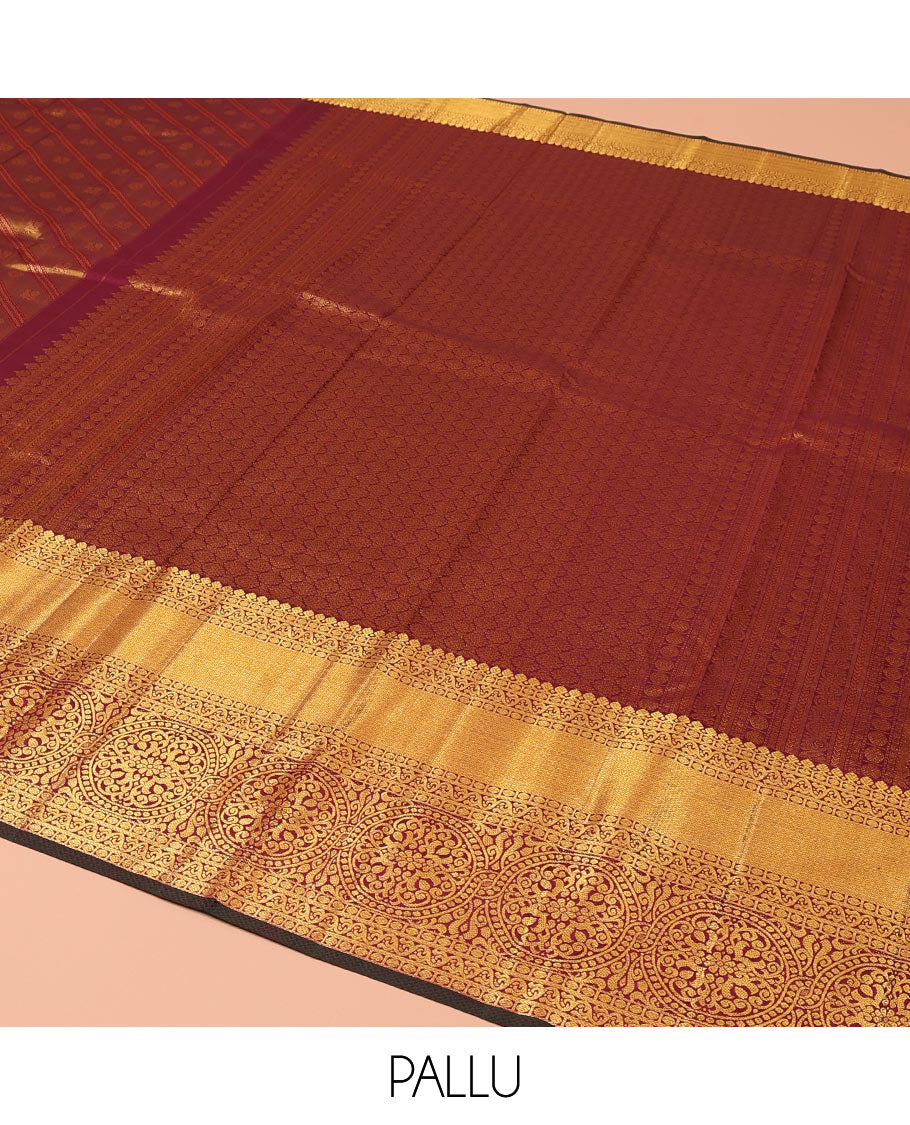 Maroon Kanchipuram Wedding Silk Saree, Mesmerized with Jacquard Design on Its Body, Highlighted by Zari Border of Thilakam Mokku, Rudraksham, Mayil Kann, and Chakram Designs, Grandly Woven Pallu, and Paired with a Matching Blouse