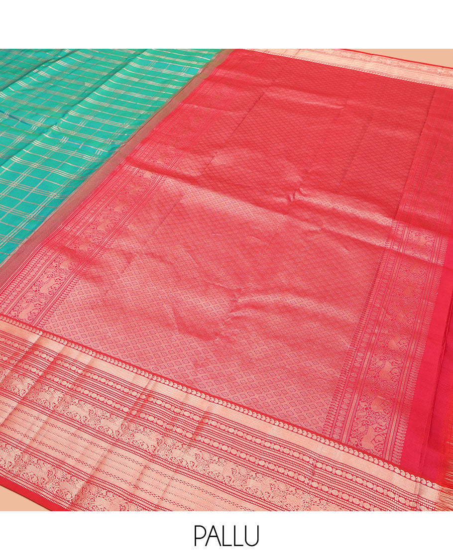 Green Vasundhara Silk Saree, Enriched with Zari Checked Designs All Over Its Body, Complemented by a Contrast Border of Manga, Muthu, Banaras, Rudraksham, and Yaali Designs, Grand Jaal Pallu, and Paired with a Contrast Blouse