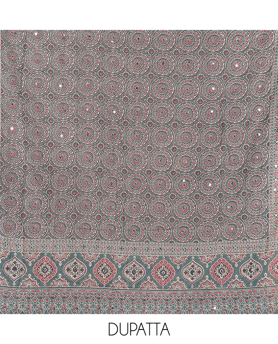 Bottle green material chudidar set, plain Vichitra silk top, santoon bottom, and dupatta of Ajrakh print and mirror work