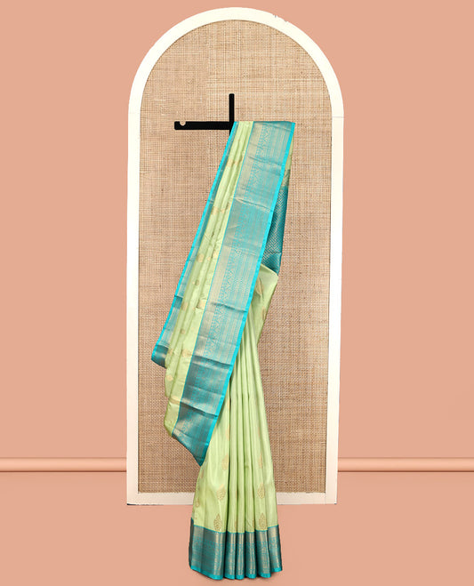 Green Vasundhara Lite Silk Mix Saree, Gleamed Up with Zari Buttas, a Contrast Traditional Zari Border, an Intricate Pallu, and a Contrast Blouse