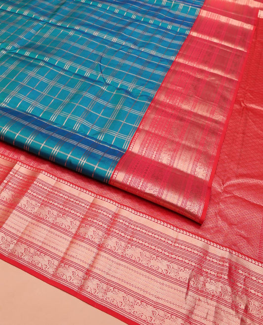 Green Vasundhara Silk Saree, Enriched with Zari Checked Design on Its Body, Complemented by Contrast Border of Manga, Muthu, Rudraksham, and Yaali Designs, Grandly Woven Jaal Pallu, and Paired with a Contrast Blouse