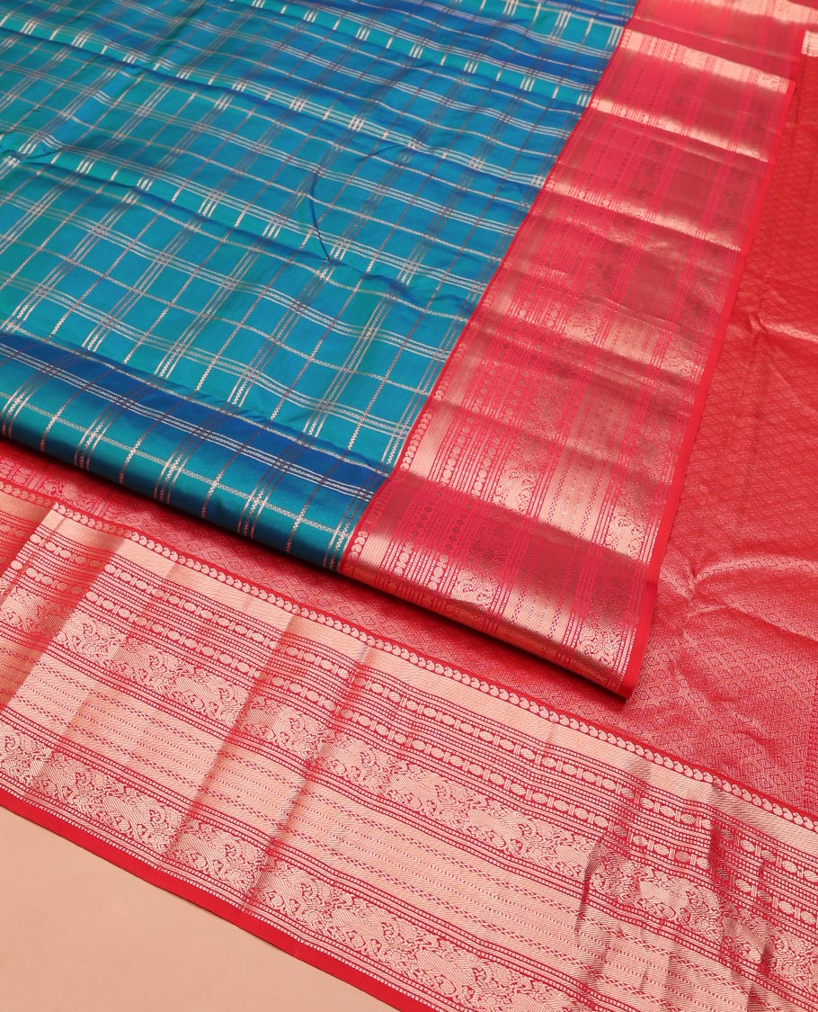 Green Vasundhara Silk Saree, Enriched with Zari Checked Design on Its Body, Complemented by Contrast Border of Manga, Muthu, Rudraksham, and Yaali Designs, Grandly Woven Jaal Pallu, and Paired with a Contrast Blouse