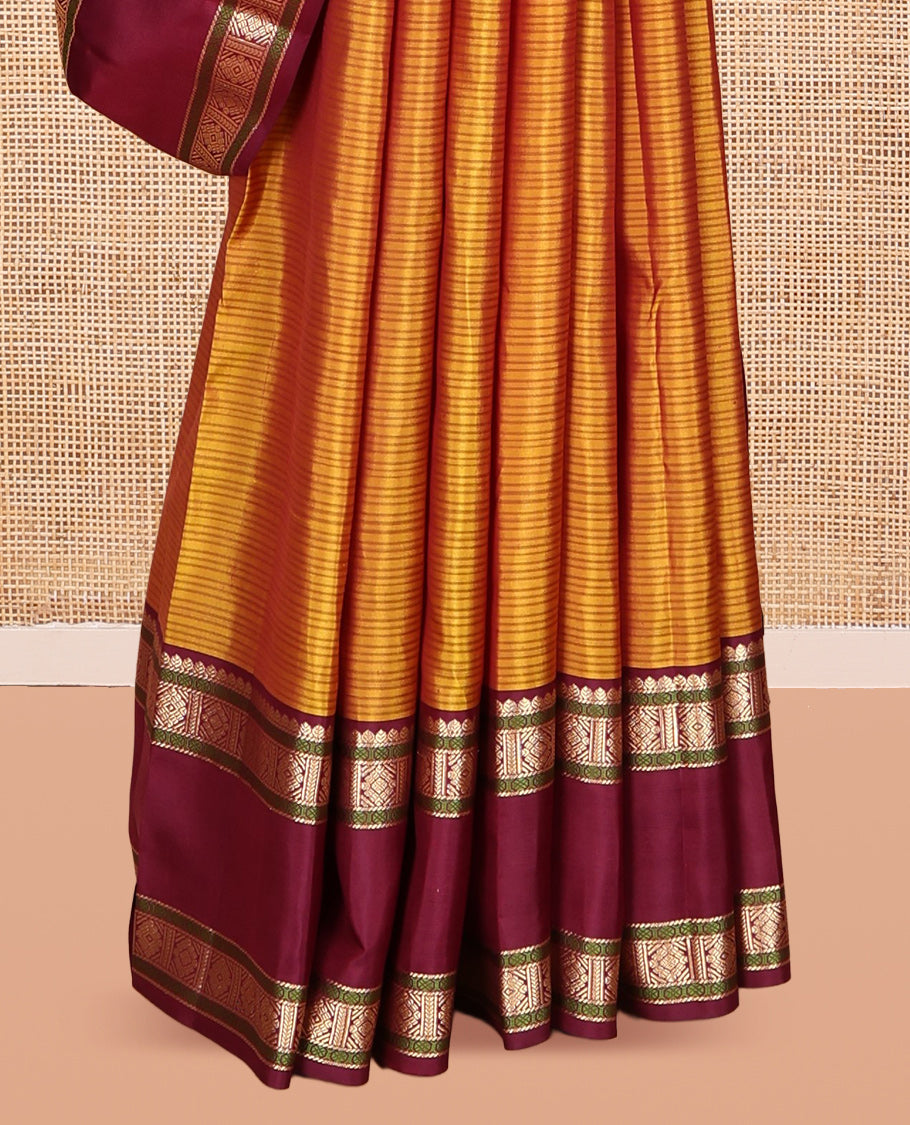 Mustard Striped Kanchipuram Silk Saree, a Contrast Rettai Pettu Border of Thilakam, Rudraksham, and Zari Designs, Intricate Pallu, and a Contrast Blouse