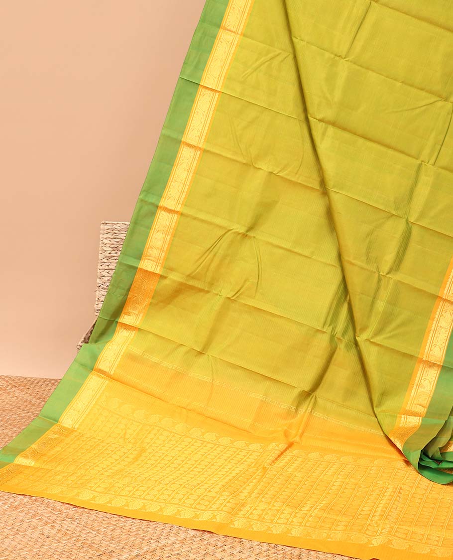 Green kancheepuram silk saree with contrast intricate zari design pallu & striped, round buttas pallu