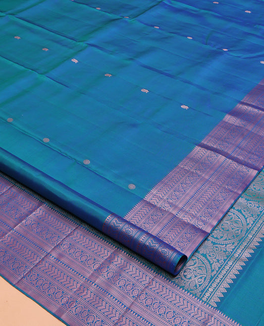Blue Kanchipuram Silk Saree, Graced with Mayil and Chakram Thread Buttas on Its Body, Highlighted by a Self-Border of Rekku, Neli, Kathir, and Kodi Visiry Designs, Pallu of Jaal Designs, and Paired with a Matching Blouse